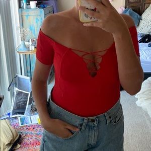 Sexy red bodysuit with clips at the bottom